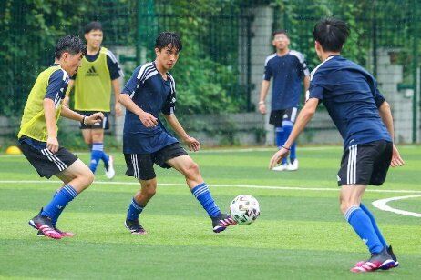 A group of boys playing football

Description automatically generated with medium confidence